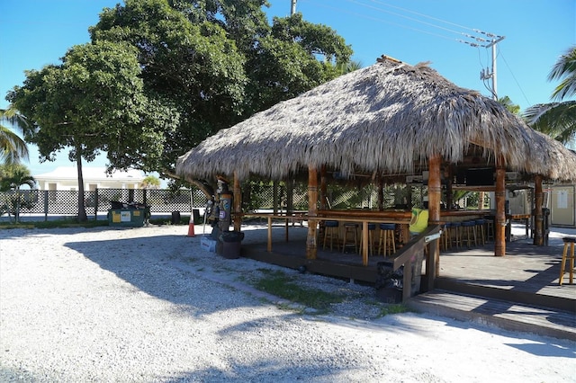 view of community featuring a gazebo and an outdoor bar