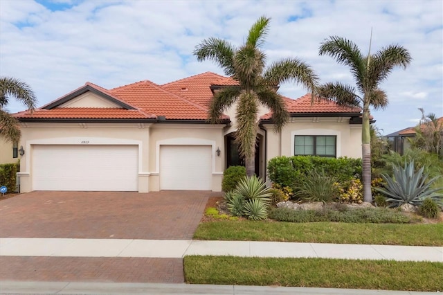 mediterranean / spanish-style house featuring a garage