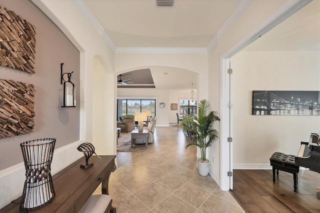 corridor featuring hardwood / wood-style floors and ornamental molding