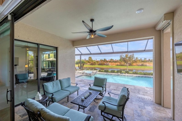 view of patio with an outdoor living space, ceiling fan, and a pool with hot tub