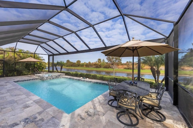 view of swimming pool with a patio, a water view, and glass enclosure