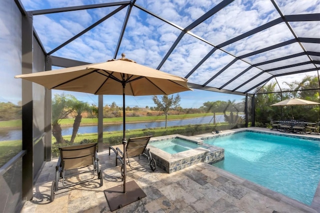 view of pool with an in ground hot tub, a patio, a water view, and a lanai