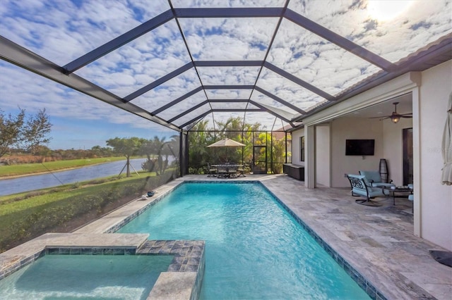 view of pool with a lanai, a patio area, and a water view