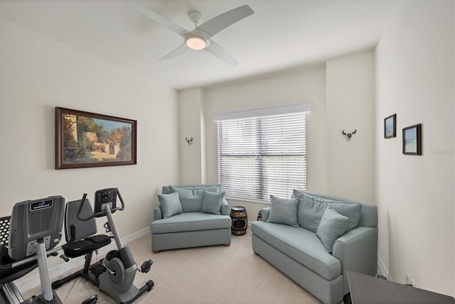 carpeted living room featuring ceiling fan