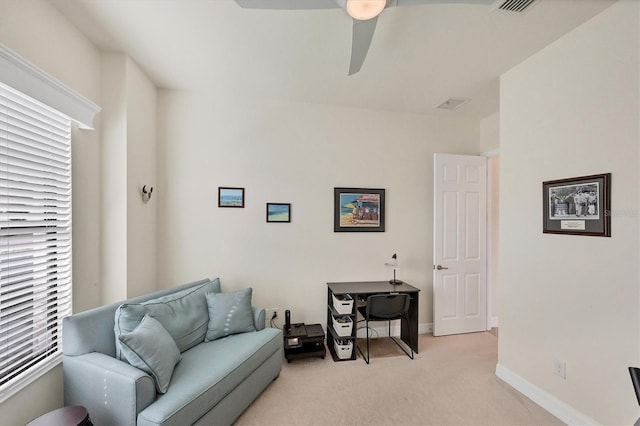 sitting room with light carpet and ceiling fan