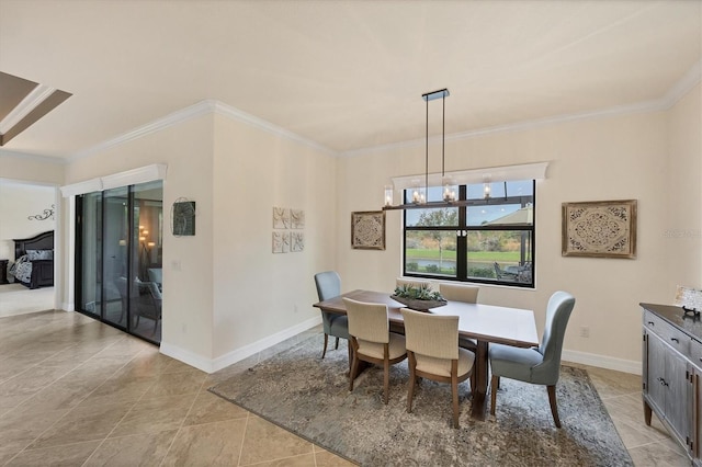 dining room featuring ornamental molding and an inviting chandelier