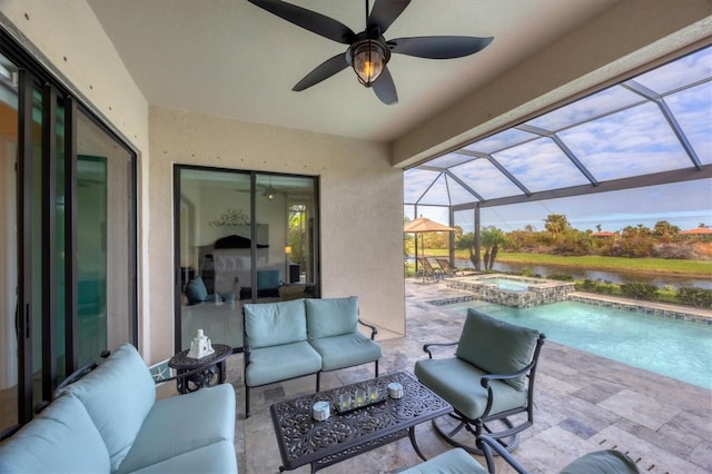 view of patio with outdoor lounge area, glass enclosure, ceiling fan, and a pool with hot tub