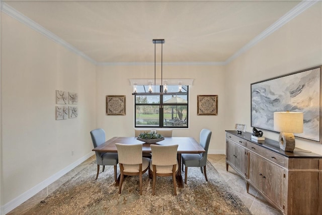 dining area with ornamental molding and a notable chandelier