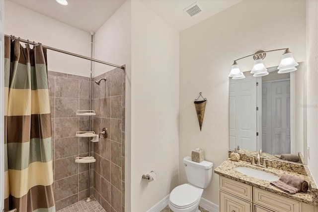 bathroom with vanity, toilet, and curtained shower