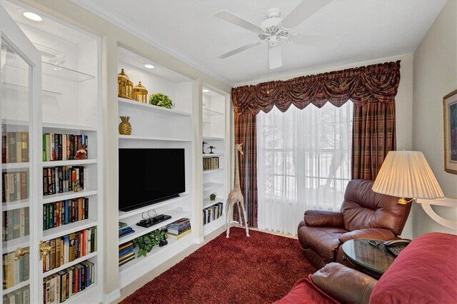 living room featuring ceiling fan, built in features, and carpet floors