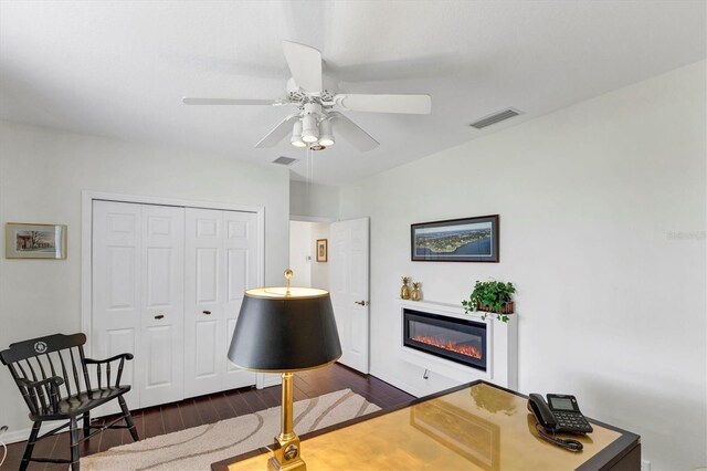 office area featuring ceiling fan and dark hardwood / wood-style floors