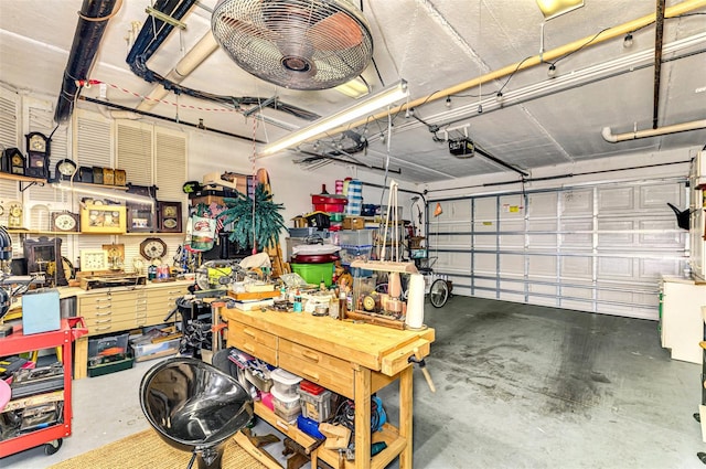 garage featuring a workshop area and a garage door opener