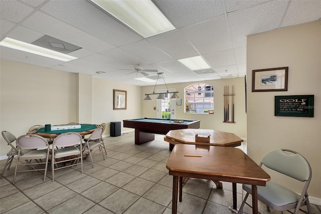 game room featuring a paneled ceiling, ceiling fan, light tile patterned flooring, and billiards