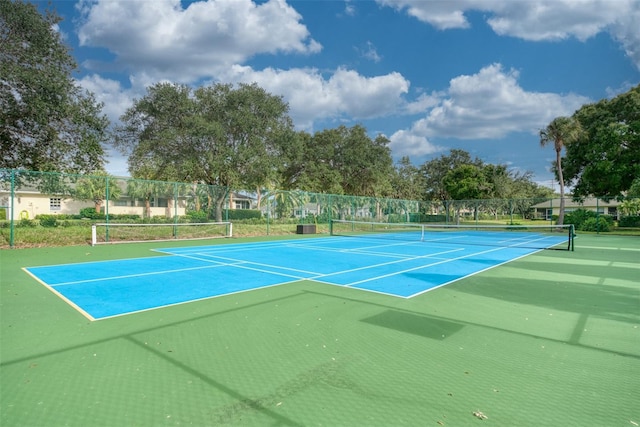 view of sport court featuring basketball hoop