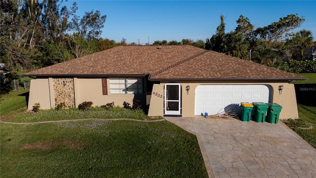 single story home with a garage and a front lawn