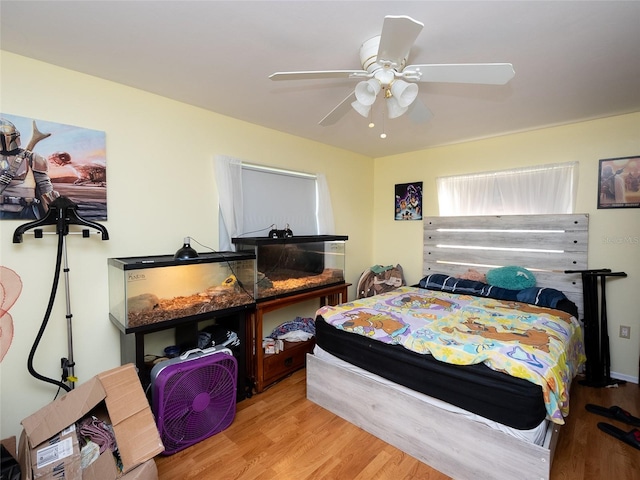 bedroom featuring light hardwood / wood-style flooring and ceiling fan