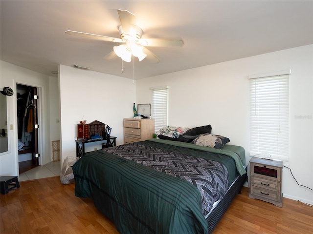 bedroom featuring ceiling fan and light hardwood / wood-style floors