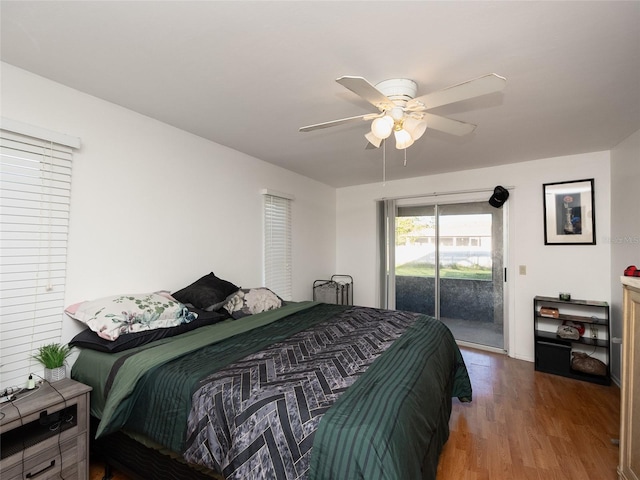 bedroom featuring access to exterior, wood-type flooring, and ceiling fan