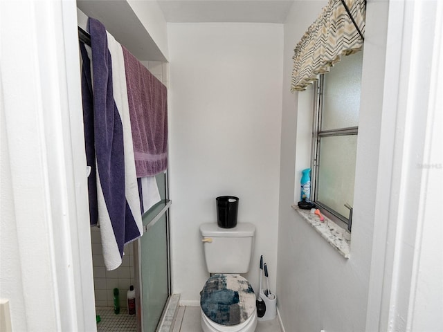 bathroom with toilet and walk in shower