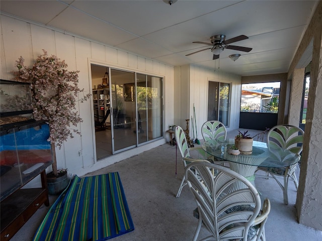 sunroom / solarium with plenty of natural light and ceiling fan