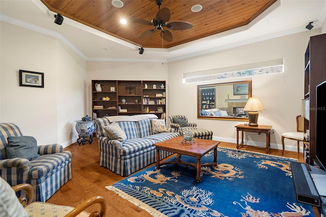 living room featuring crown molding, ceiling fan, a tray ceiling, wood-type flooring, and wood ceiling