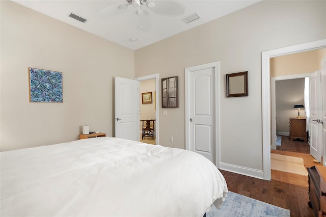 bedroom featuring ceiling fan and dark hardwood / wood-style floors