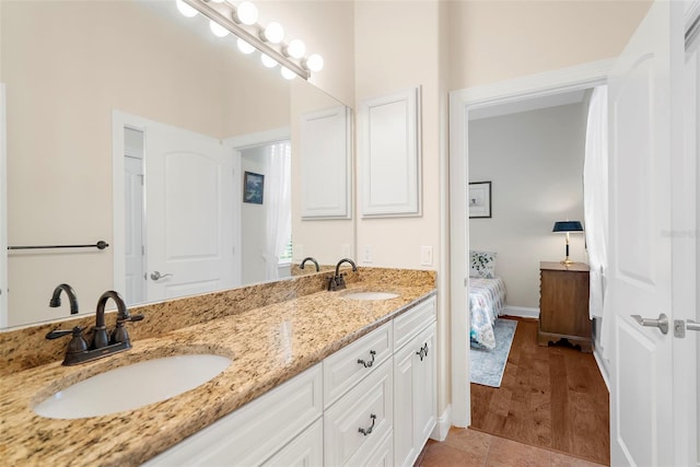 bathroom featuring hardwood / wood-style floors and vanity