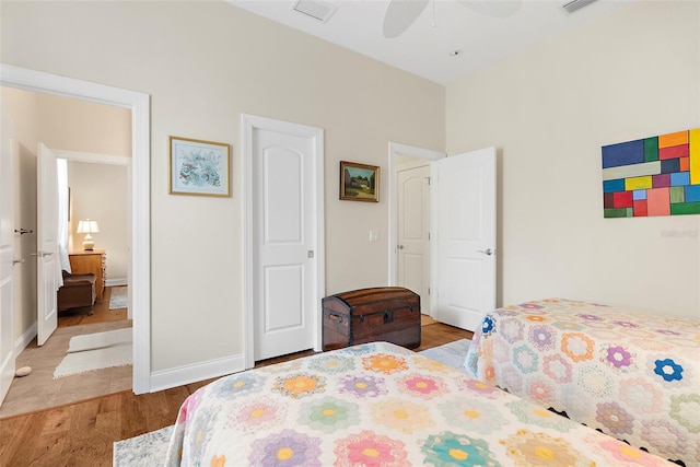 bedroom with ceiling fan and light hardwood / wood-style floors