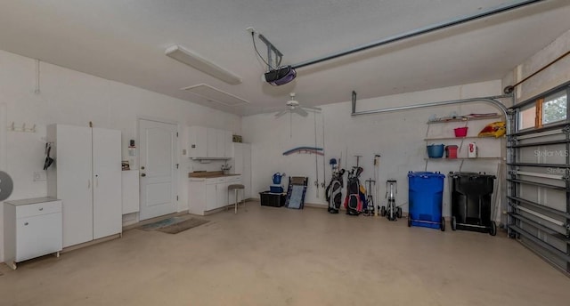 garage with ceiling fan and a garage door opener