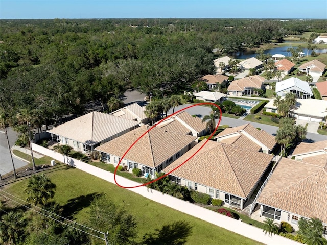 birds eye view of property with a water view