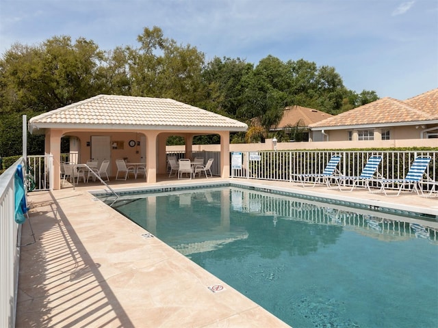 view of swimming pool with a patio