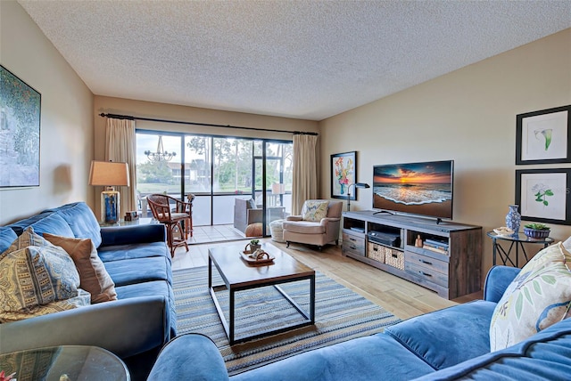 living room featuring a textured ceiling and light hardwood / wood-style floors