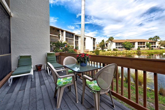 wooden deck with a water view