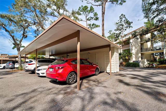 view of parking / parking lot with a carport