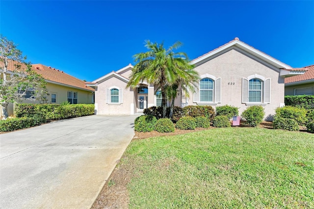 single story home with a front yard