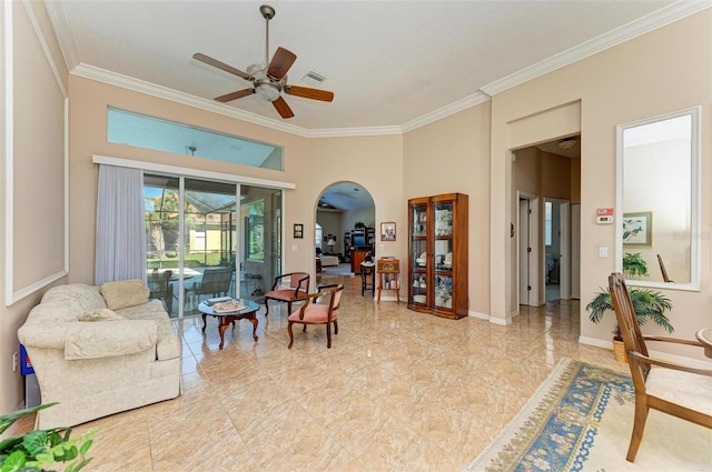 living area featuring a high ceiling, ceiling fan, and crown molding