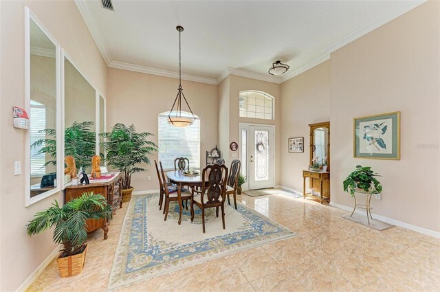 dining area featuring light tile patterned floors and ornamental molding