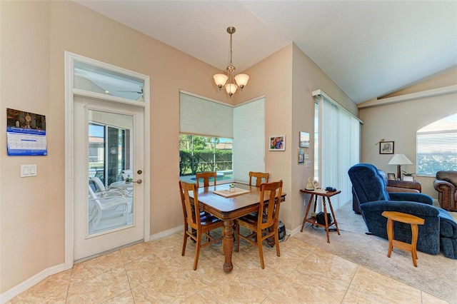 dining room featuring light tile patterned floors, ceiling fan with notable chandelier, and lofted ceiling