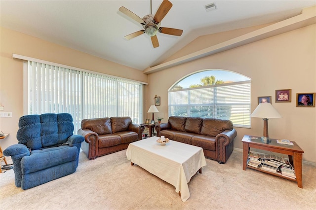 carpeted living room featuring ceiling fan and vaulted ceiling