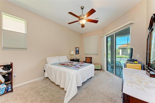 carpeted bedroom with access to outside and ceiling fan