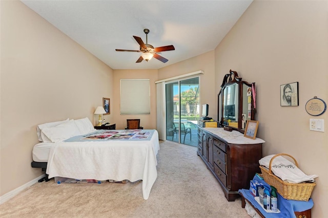 carpeted bedroom featuring access to exterior and ceiling fan