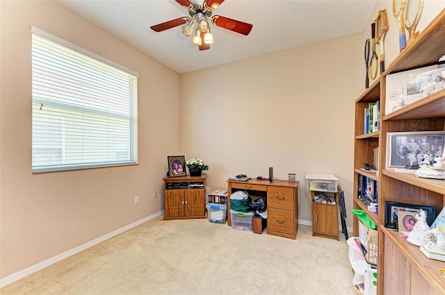 office with ceiling fan and light carpet