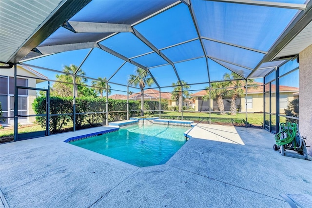 view of pool with a lanai and a patio