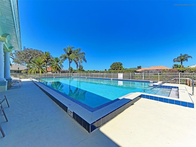 view of swimming pool with a patio area