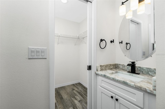 bathroom featuring vanity and hardwood / wood-style floors