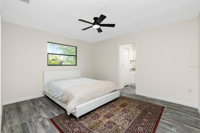 bedroom with ceiling fan and dark hardwood / wood-style flooring