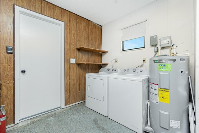 clothes washing area with washing machine and dryer and electric water heater