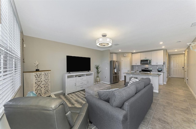 living room with light tile patterned flooring