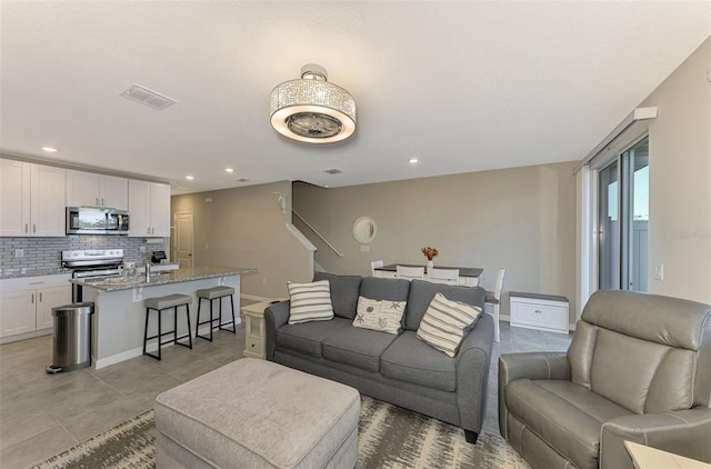 living room featuring light tile patterned floors