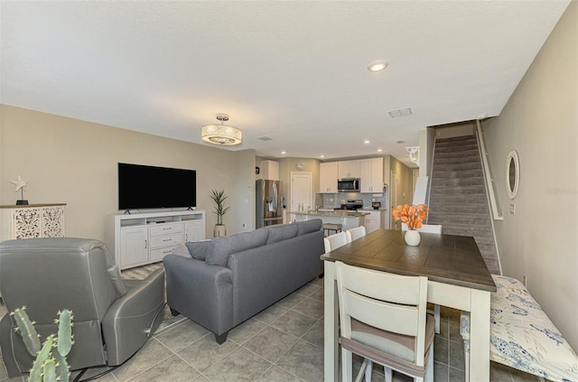 living room featuring light tile patterned floors